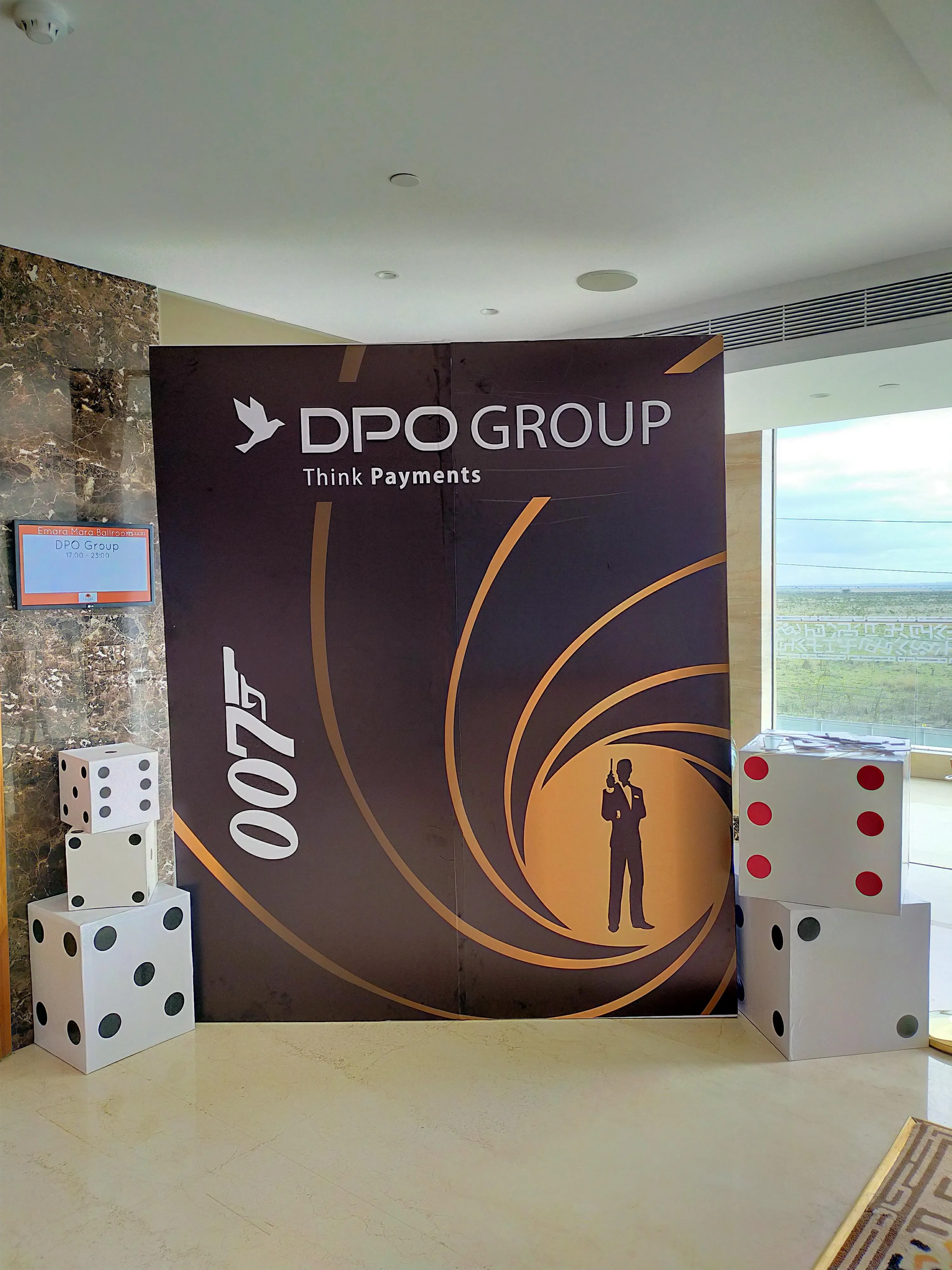James Bond 007 themed gala backdrop for DPO Group with oversized dice props
